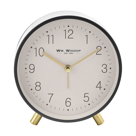 Round alarm clock with cream dial, Arabic numerals, and grey metallic case on two gold metal feet, shown on a plain white background.