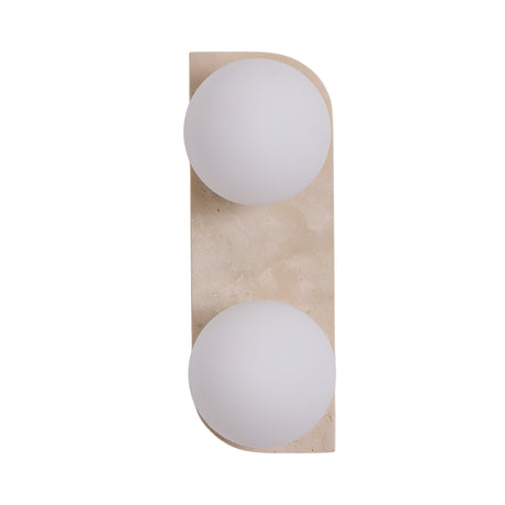 The Virella 2 Light Vertical Travertine Wall Light in light beige features a rectangular base with rounded edges and two vertically arranged opaque white glass globes.