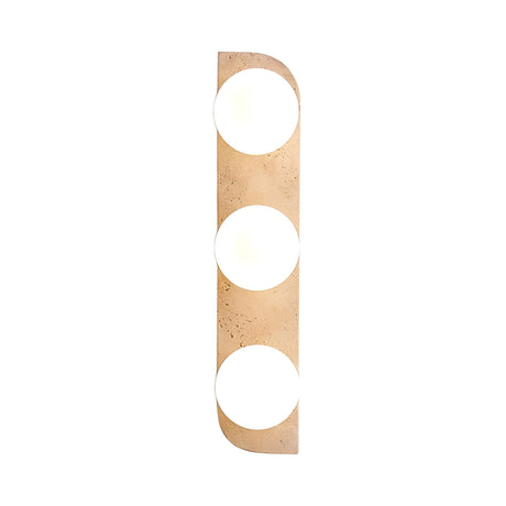 The Virella 3 Light Vertical Travertine Wall Light in light beige features three evenly spaced cutouts glowing with bright white light, creating a layered ambient effect against a plain white background.