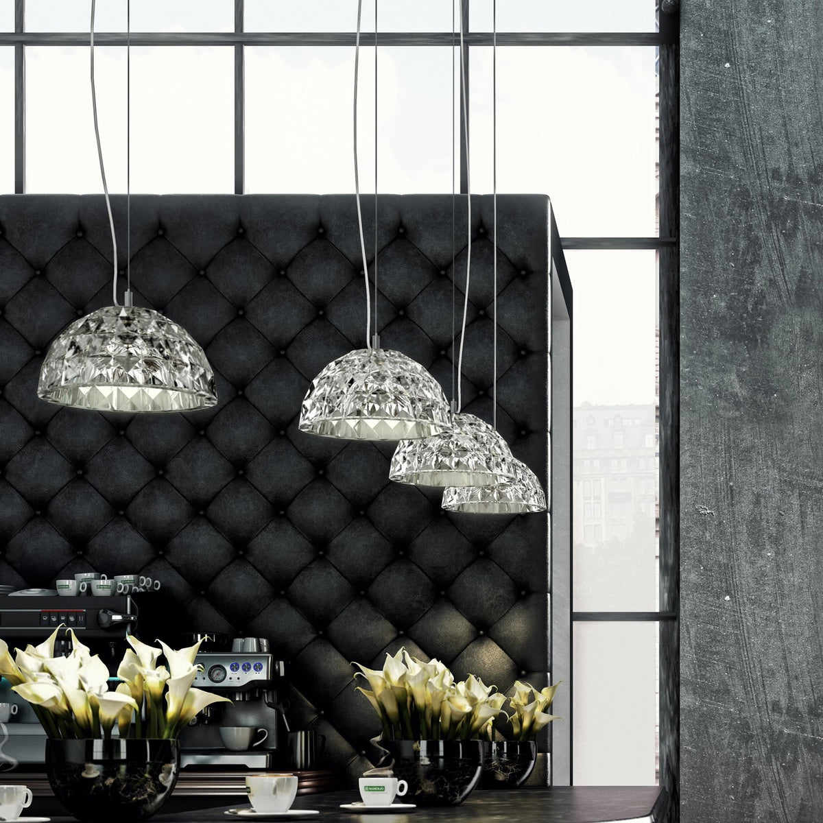 Deco Crystal Pendant Light in chrome, three dome-shaped faceted crystal shades hung at staggered heights above a dining table in a dark tufted-leather interior.