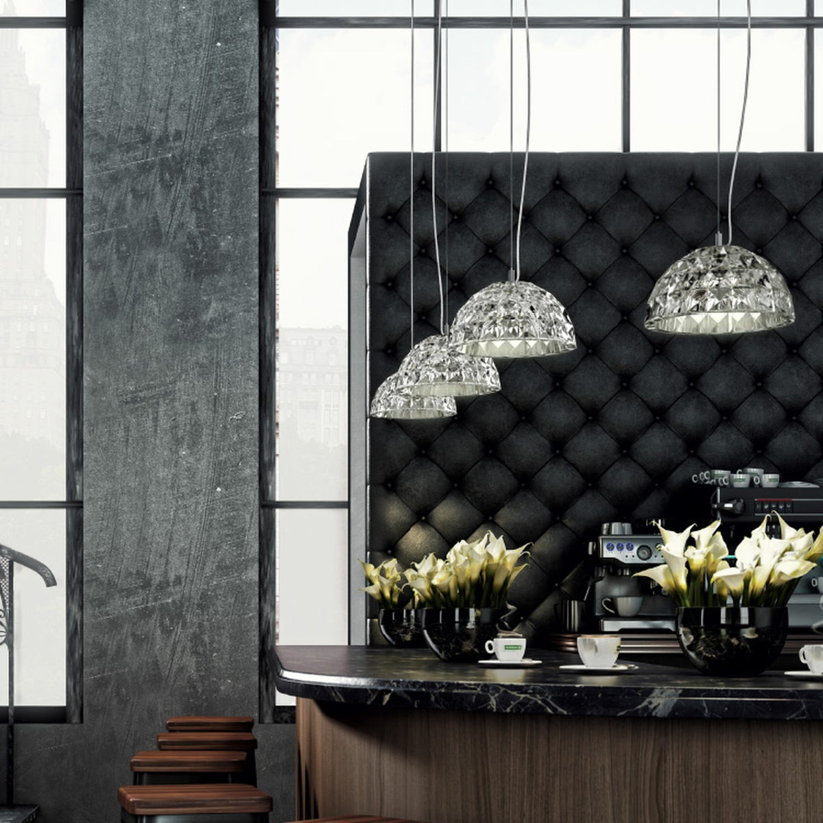 Deco Crystal Pendant Light in chrome, dome-shaped faceted crystal shades on slim cables above a tufted black banquette in a café setting.