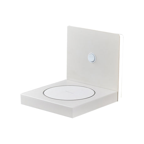 Sand white Zanzibar LED wall light, an L-shaped matt metal fixture with a backlit panel, touch switch, and a shelf with wireless phone charging pad.