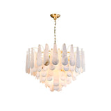The Veloria Small Floating Petal Alabaster Chandelier in brushed brass and soft white features a compact, sculptural design with layered alabaster petals arranged in tiered circles for an elegant, modern look.