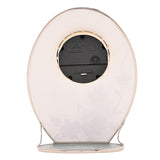 Rear view of the Butterfly & Crystal Flowers Oval Glass Mantel Clock showing the quartz movement, battery compartment, and chrome stand on a white background.