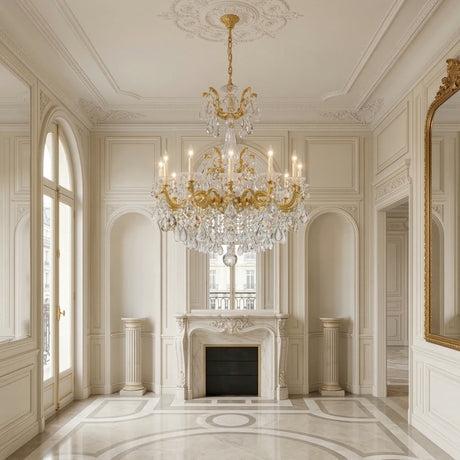 Elegant, sunlit room with cream walls, ornate molding, marble fireplace, and arched windows; a Vienna 12 Light K9 Crystal Chandelier in heirloom gold sparkles above as a gilt mirror reflects the classic French-style decor.