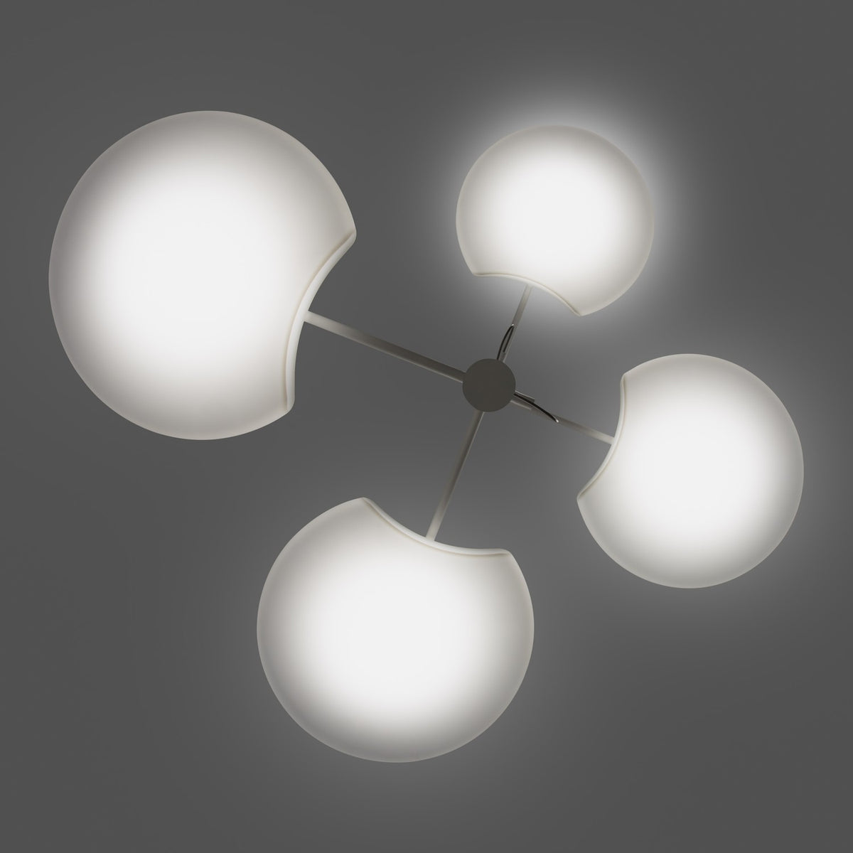 SuperMoon LED 4 Light Pendant in white, four crescent-cut round shades glowing on slim arms from a central stem, set against a plain grey background.