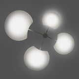 SuperMoon LED 4 Light Pendant in white, four crescent-cut round shades glowing on slim arms from a central stem, set against a plain grey background.