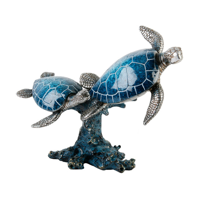Resin figurine of two swimming turtles on a coral-style base, with glossy blue marbled shells and textured silver heads and flippers, set against a plain white background.