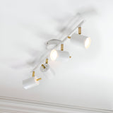 Endon Radnor 4 Light Spotlight Bar in matt white with brass fittings, four adjustable cylindrical heads on a slim ceiling-mounted bar.
