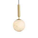 The Lucentis 1 Light Globe Alabaster Single Pendant Light in Soft White & Brass hangs elegantly, adding a modern touch and gentle illumination to any space.