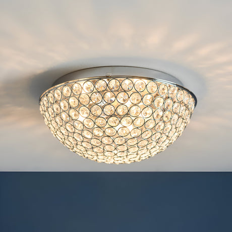 Endon Cordelia 3 light crystal flush bathroom ceiling light in chrome, illuminated on a white ceiling with a dark blue wall below.