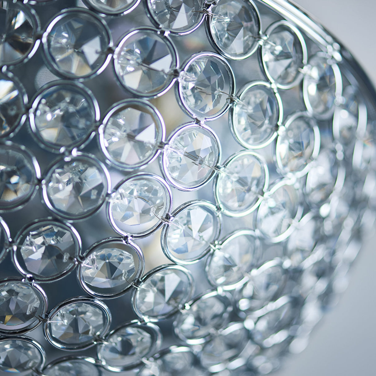 Close-up of the Endon Cordelia flush bathroom ceiling light showing its domed chrome frame set with rows of faceted clear crystals.