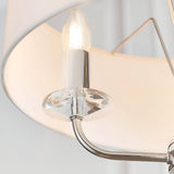 Close-up of Endon Castdon 3 Light Pendant showing a nickel arm, K9 crystal bobeche, E14 candle bulb, and vintage white faux silk shade.