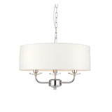 Endon Castdon 3 light pendant with nickel arms, K9 crystal detailing and a wide vintage white faux silk drum shade, on a plain white background.
