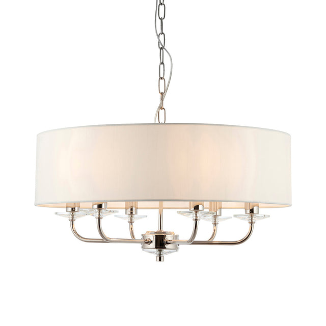 Castdon 6 Light Pendant in nickel with a large white drum shade, six curved arms, crystal accents and hanging chain, shown on a plain white background.