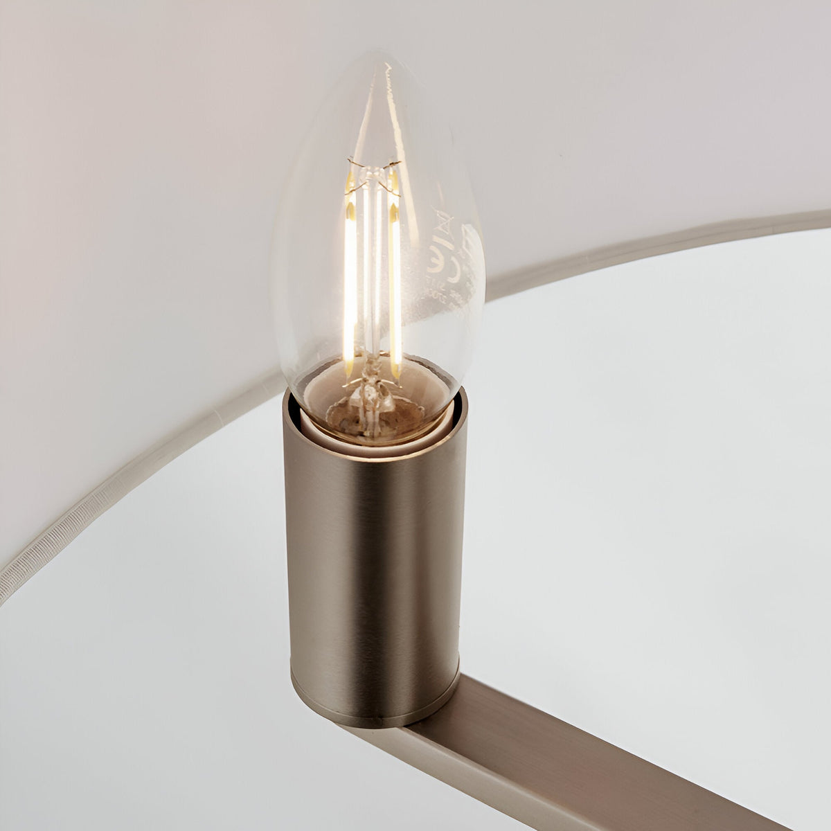 Close-up of the Endon Bexley Large 3 Light Pendant showing a brushed nickel E14 lamp holder with a clear candle filament bulb beneath the white shade.
