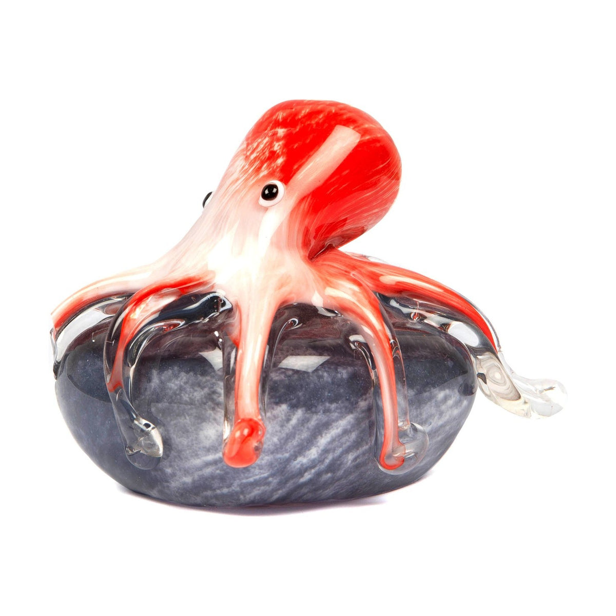 Glass octopus figurine with a red and white streaked head and body, clear glass tentacle tips, draped over a swirled grey rock base on a plain white background.