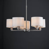 Bexley 5 Light Pendant in matt nickel with five curved arms and white faux silk drum shades, shown against a dark background.