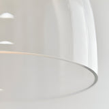 Close-up of the Endon Brackmere pendant light showing the clear glass shade's curved profile and polished chrome trim around the rim.