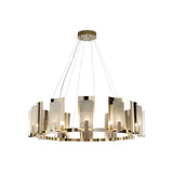 The Aurevon 6 Light Circular Alabaster Chandelier features a modern gold frame with vertical Spanish alabaster panels, suspended from a round mount. Soft white and copper accents provide an elegant, warm glow.