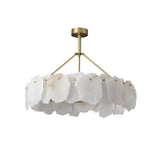 The Marvion LED Small Petal Alabaster Chandelier in Soft White & Brass features a gold frame and circular arrangement of irregular, translucent white panels reminiscent of natural stone or petals.