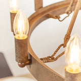 Close-up of the Bevgrove 12 Light Pendant's aged metal ring frame with candle-style E14 fittings and exposed filament bulbs.