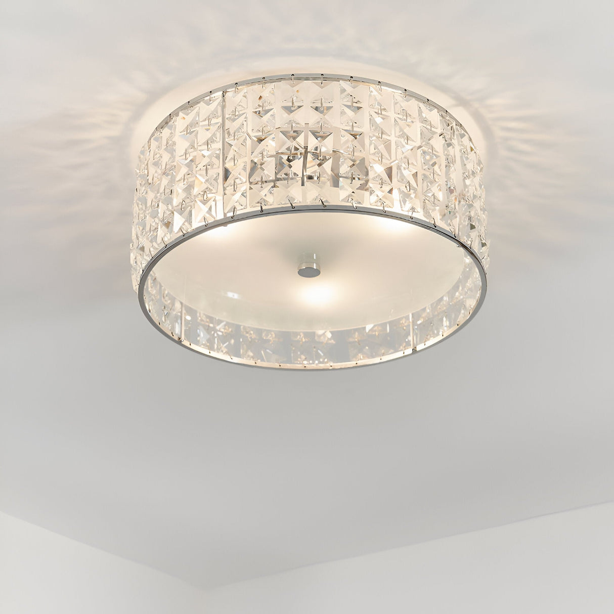 Endon Ophelia 3 light flush bathroom ceiling light in chrome with crystal detailing and frosted glass diffuser, mounted to a white ceiling.