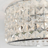 Close-up of Endon Ophelia flush bathroom ceiling light showing square-cut crystals set in a chrome drum frame.