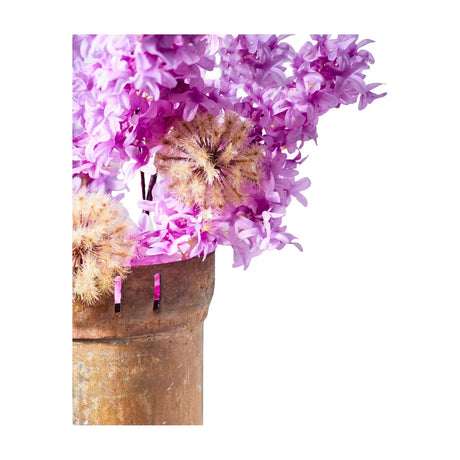 Libra Interiors textured faux lilac stems in purple, arranged with dried seed heads in a weathered terracotta urn against a white background.