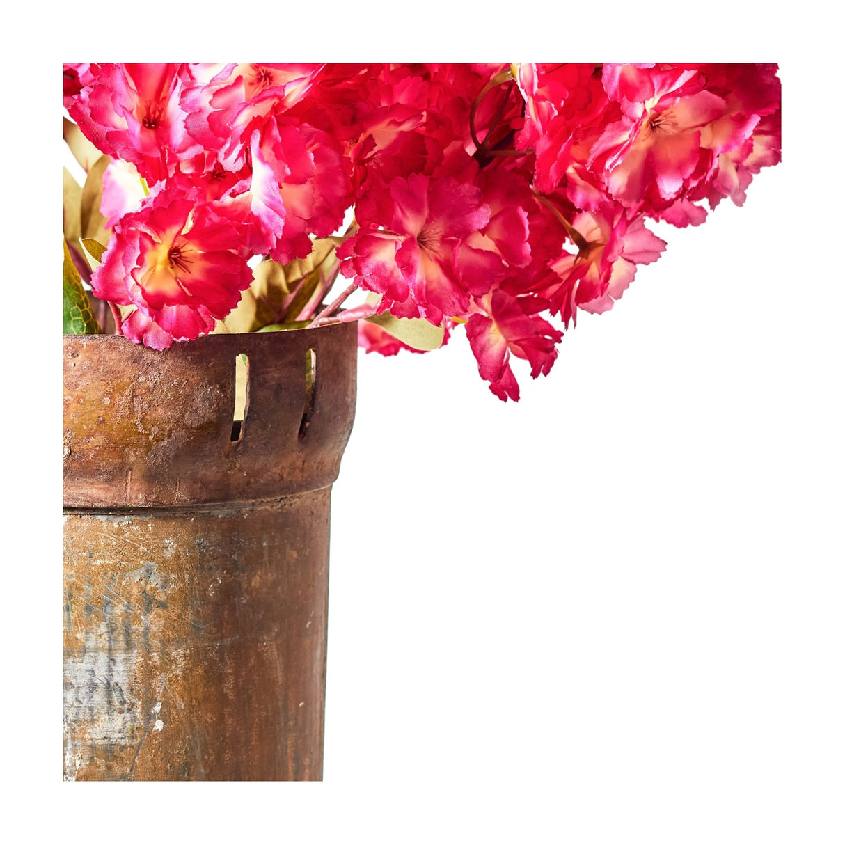 Libra Interiors cherry blossom faux stems with clustered vibrant pink ruffled blooms and green leaves arranged in a rustic weathered metal urn on white.
