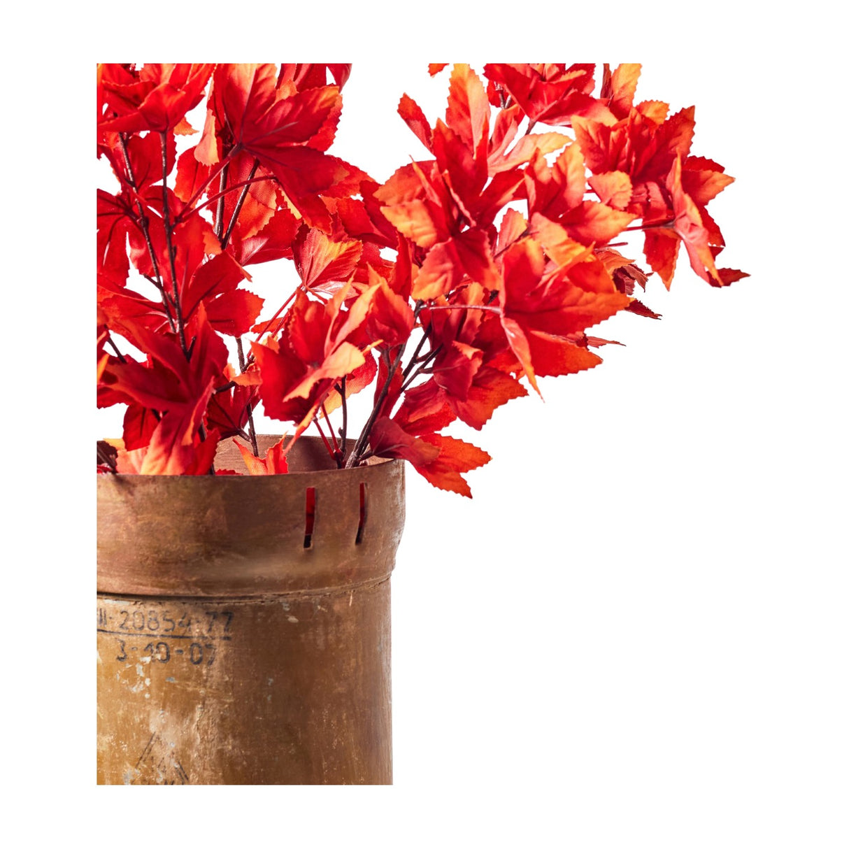 Libra Interiors Textured Red Japanese Maple faux stems with crimson and orange leaves arranged in a rustic metal urn against a plain white background.