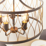 Hulton 5 Light Pendant close-up showing matt black drum frame with bronze lattice wirework and five exposed E27 filament bulbs on visible holders.