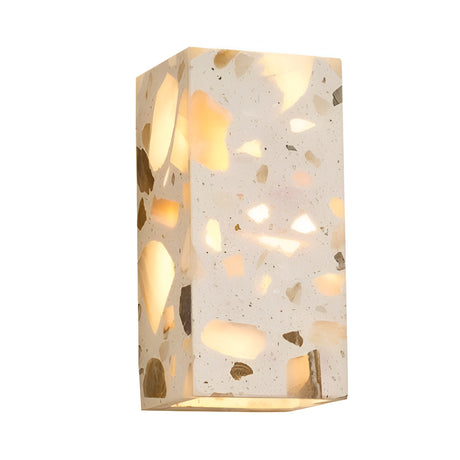 The Terrano 1 Light Rectangular Travertine Wall Light in light beige features a modern design and emits a warm, inviting glow from within its travertine surface, creating an elegant ambiance on any wall.