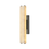 The Selvara LED Medium Alabaster Double Wall Light in matte black & soft white features a sleek backplate and vertical cylinder shades, providing soft, warm illumination with a modern design.