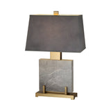 The Karsen 1 Light Framed Marble Table Lamp features a brass and black frame, a rectangular marble base, and a wide gray shade—modern architectural lighting shown on a white background.