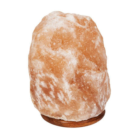 Himalayan rock salt lamp in natural peachy-pink stone with white veining, set on a round wooden base, shown on a plain white background.