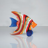 Multicoloured Striped Fish Miniature Glass Figurine, 7cm, with orange, red, black, white and green banded body, blue tail and fin, orange face, on a plain light background.