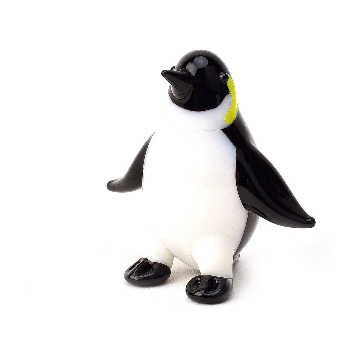 Penguin Miniature Glass Figurine in glossy black and white, with a white front, black head and raised beak, outstretched wings, and black feet, set against a plain white background.