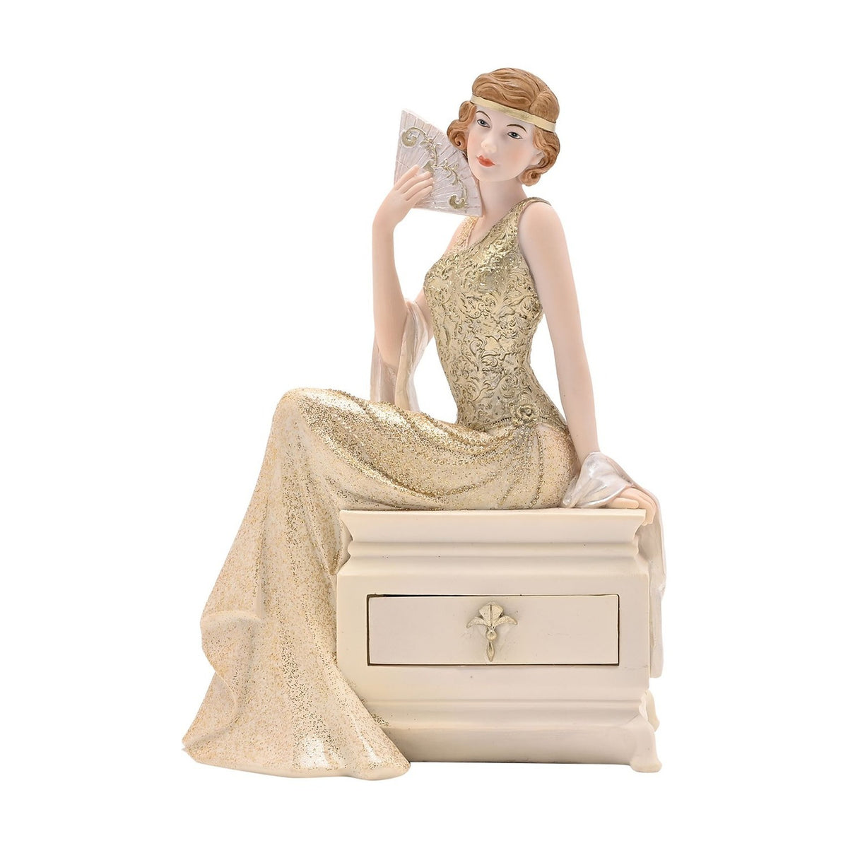 Resin trinket box with a drawer, featuring a seated 1920s lady in a gold scrollwork gown and headband holding a fan, on a cream chest against a plain white background.