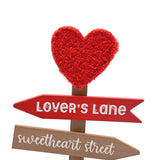Valentine's Love Heart Signpost MDF wall art with a textured red heart topper and red and natural wood-effect arrows reading "Lover's Lane" and "sweetheart street", on a plain white background.