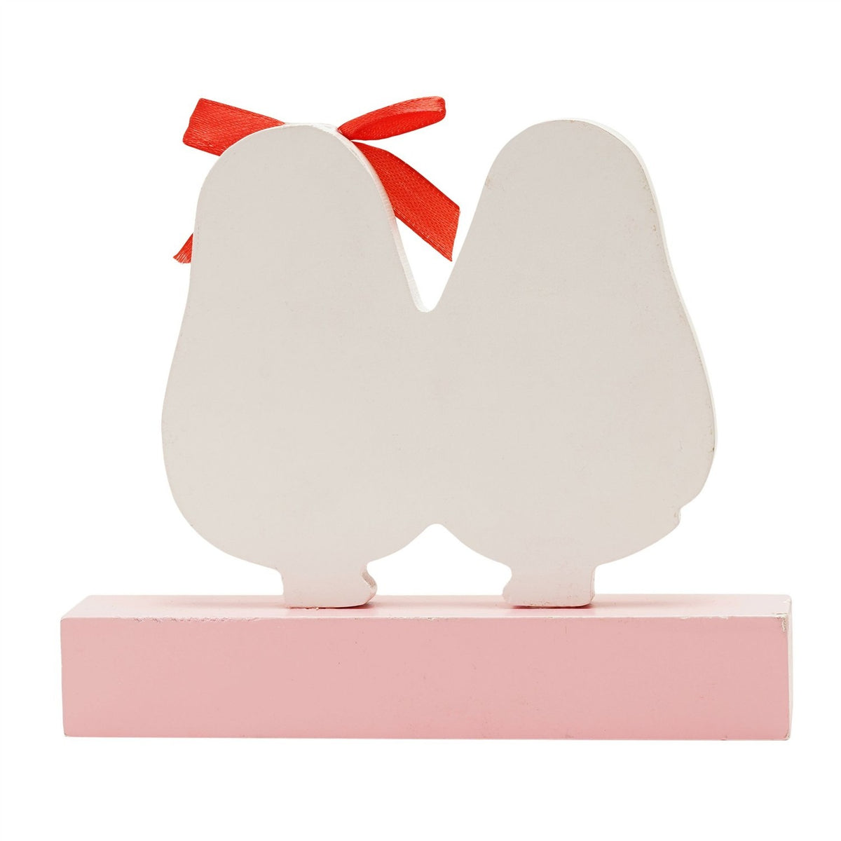 Wooden plaque featuring two joined avocado-shaped figures in white, one with a red ribbon bow, set on a pale pink block base, shown on a plain white background.