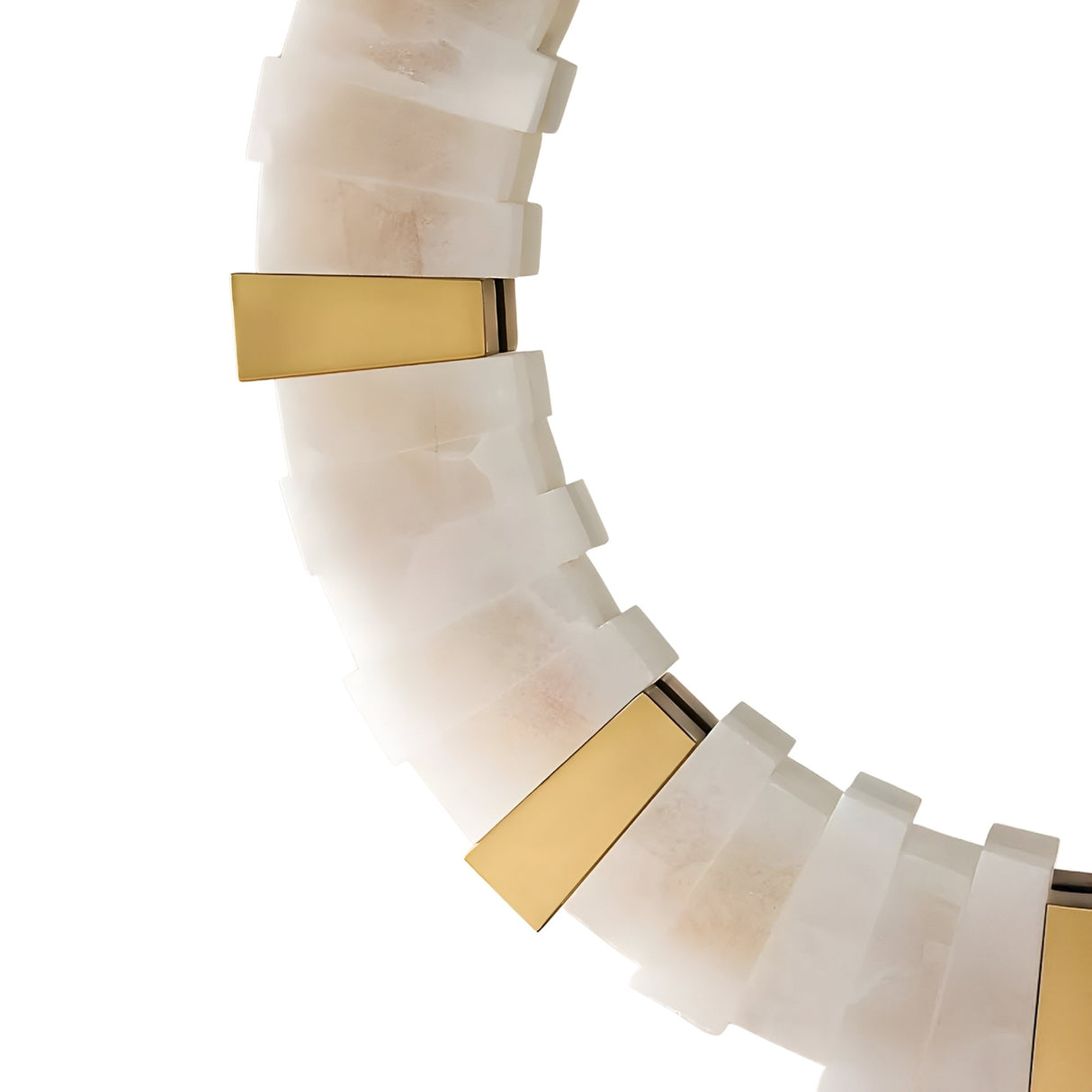 Close-up of the Lumessa LED Alabaster Mirror Light in Brushed Brass & Soft White, showcasing sculptural alternating white and gold metallic segments in a repeating pattern against a white background.