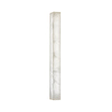 The Valmera LED Medium Slim Vertical Alabaster Wall Light in soft white features a tall, slender rectangular design with a smooth, marble-like surface and subtle grey veining that emits a gentle, diffused glow.