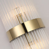 The Oriana 2 Light Crystal Wall Light - Gold features vertical glass rods, a central gold metallic band, and LED rows, creating a sleek, luxurious look that adds contemporary elegance to any space.