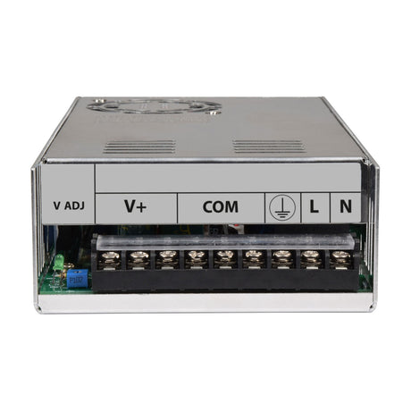 Front terminal view of the AVSL Mercury 13.8V 25A switch mode PSU showing labelled V ADJ, V+, COM, earth, L and N screw terminals in a metal casing.