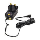 Mercury SMDC401UK 12W switch-mode power supply with UK plug, yellow voltage selector dial and coiled detachable DC cable on a white background.