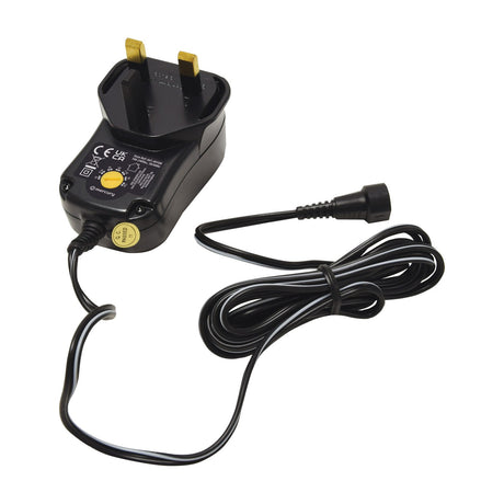 Mercury SMDC401UK 12W switch-mode power supply with UK plug, yellow voltage selector dial and coiled detachable DC cable on a white background.