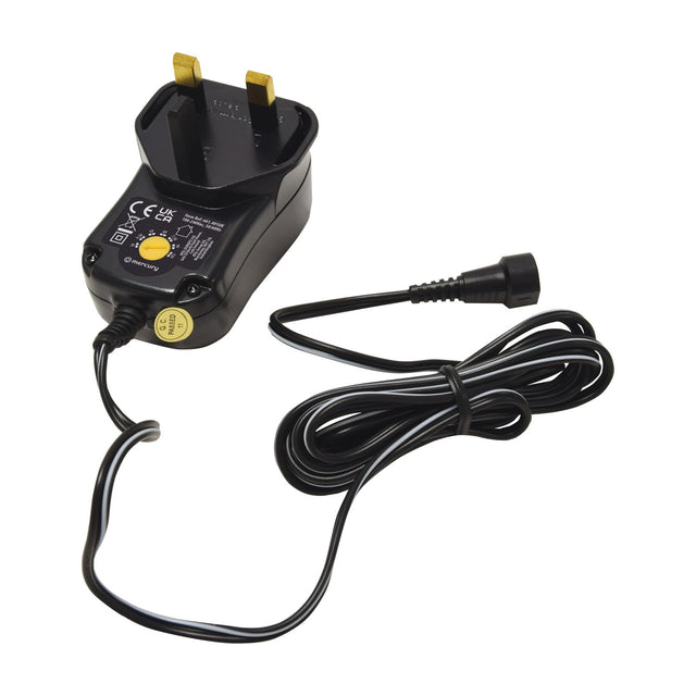 Mercury SMDC401UK 12W switch-mode power supply with UK plug, yellow voltage selector dial and coiled detachable DC cable on a white background.