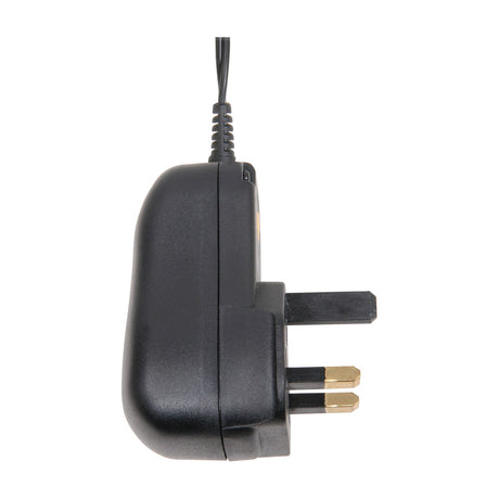Side view of the Mercury SMDC401UK 12W switch-mode power supply in black, showing the moulded UK three-pin plug and cable exit on white.