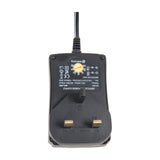Mercury SMDC403UK 18W multi-voltage power supply in black, showing UK three-pin plug, rotary voltage selector dial, and rating label on a white background.